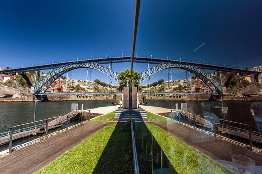 Mirror view of bridge over the river