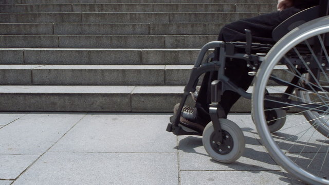 wheelchair approaching stairs low angle view