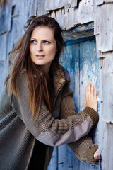 Fototapeta premium Scared woman pushing into a door
