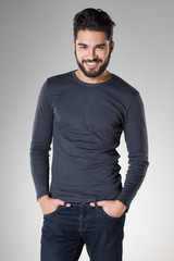 attractive sexy man with beard dressed casual smiling