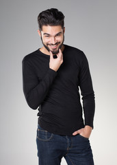 attractive sexy man with beard dressed casual smiling