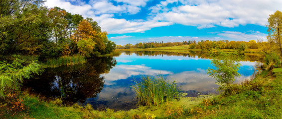 Forest lake in fall. Panorama