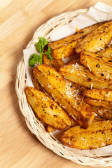 Portion of fresh Potato Wedges With Parmesan