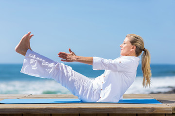 Fototapeta na wymiar healthy mid age woman yoga exercise