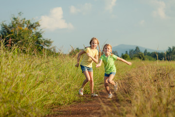 two girls running on the road