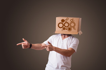 Young man gesturing with a cardboard box on his head with spur w