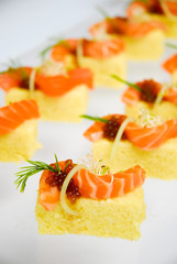 Sushi cake with salmon and red caviar
