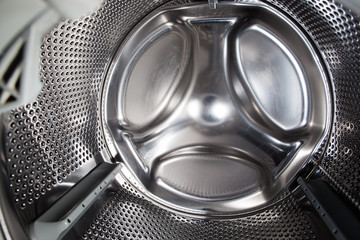 Washing machine inside view without textile (color toned image) - obrazy, fototapety, plakaty