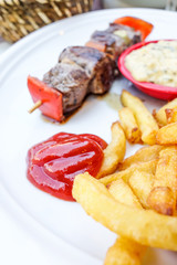 tasty grilled meat and vegetables skewers