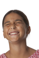 Young teenage girl closing eyes with excitement