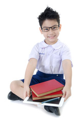 Little asian boy in student's uniform with tablet computer on is