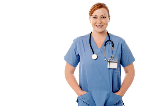 Female physician posing against white