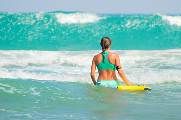 Surfer girl - body surfing beach woman laughing having fun