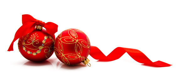 Two red christmas balls with ribbon isolated on a white