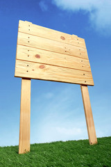 Wooden sign under the blue sky