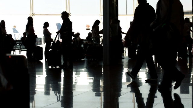 Outline silhouette of people at the airport