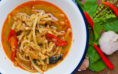 Thai hot and spicy curry with chicken and bamboo shoot on table