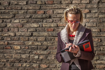 Businesswoman standing on a historic street