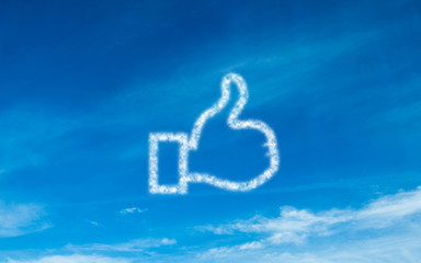 Fototapeta premium White thumb up icon in sky