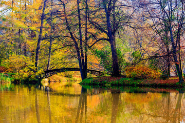 Autumn - Old bridge in autumn misty park