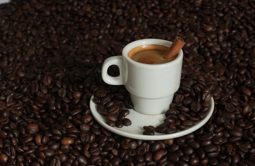 cup of coffee with coffee beans.