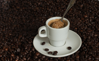 cup of coffee with coffee beans.