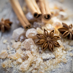 Cinnamon sticks and star anise on brown sugar, Christmas spces