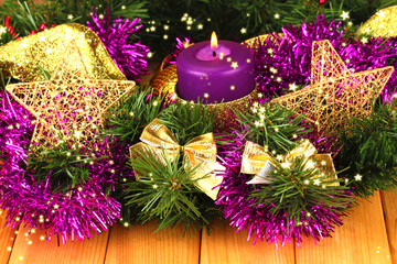 Christmas composition  with candles and decorations in purple