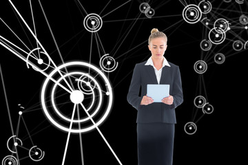 Composite image of businesswoman holding new tablet