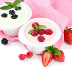 Delicious yogurt with berries isolated on white
