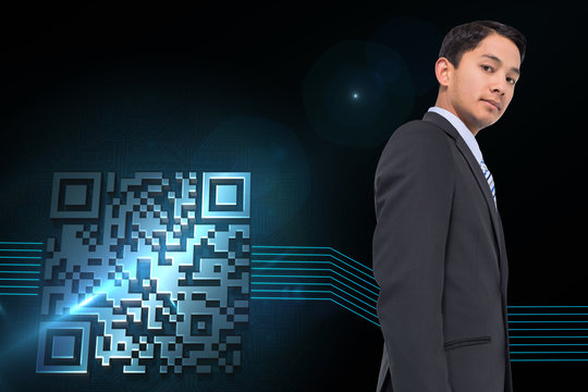 Composite image of serious asian businessman