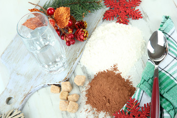 Cooking Christmas cookies on wooden table