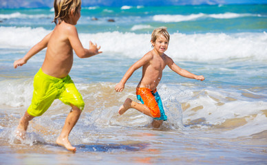 Two young boys having fun on tropcial beach