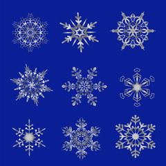 Fototapeta na wymiar silver snowflakes on a blue background