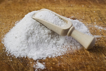 pile of salt and wooden scoop