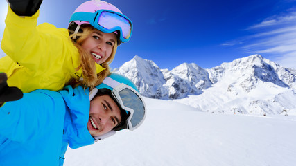 Skiing, winter sports, couple having fun on ski