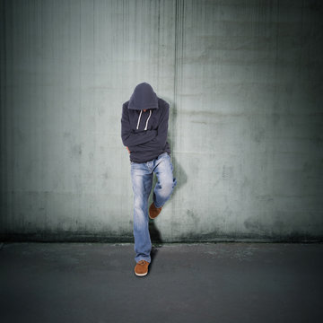 Young Guy Leaning Against The Wall