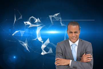Composite image of doubtful young businessman with arms crossed