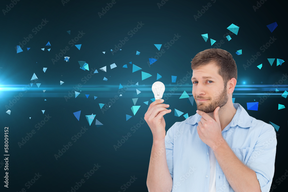 Poster composite image of handsome model holding a bulb