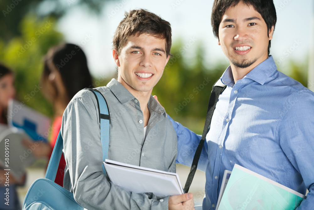 Wall mural male friends smiling on college campus