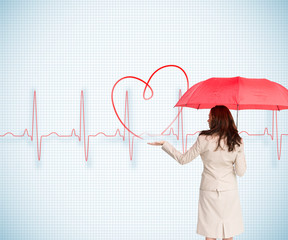 Composite image of businesswoman holding umbrella