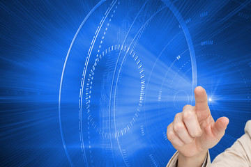 Fototapeta premium Composite image of businesswoman touching invisible screen