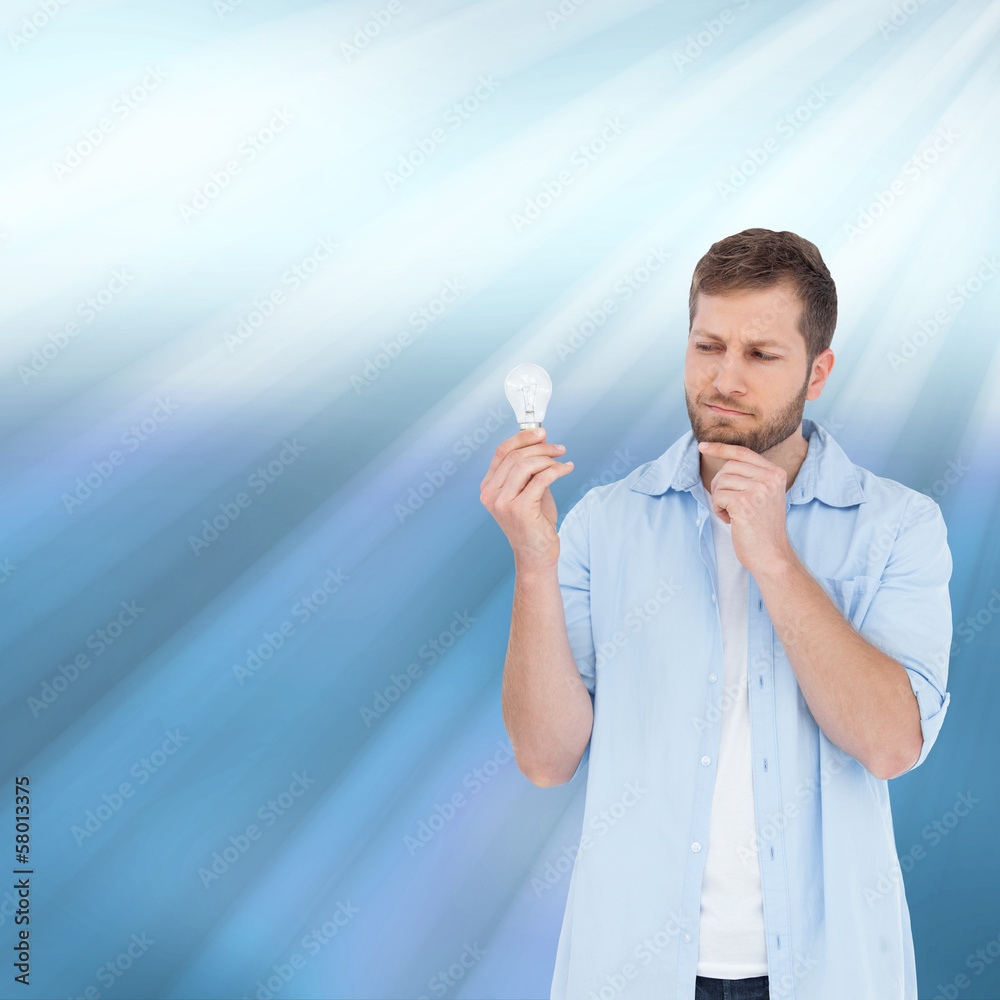 Poster composite image of sceptical model holding a bulb