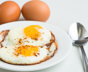 Fried eggs. Simple, delicious, healthy meal on white background