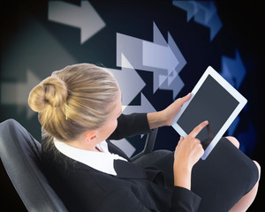 Composite image of businesswoman sitting on swivel chair with ta - Powered by Adobe