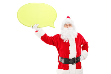 Smiling Santa Claus holding a speech bubble