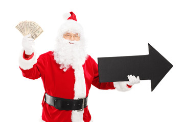 Smiling Santa Claus holding black arrow and dollars