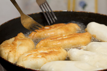 patties are fried in a pan