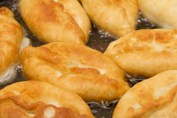 patties are fried in a pan