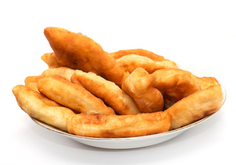 Russian patties in the plate on white background